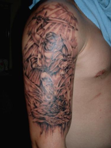 My Tattoo - This is a pick of my tattoo of St. Michael vs. The Devil. Its red becuase this is a pic form a year ago right after it was done.
