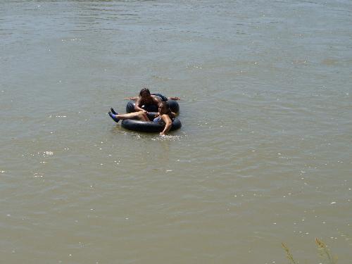 Friends - Friends floating down a river enjoying a nice hot day.