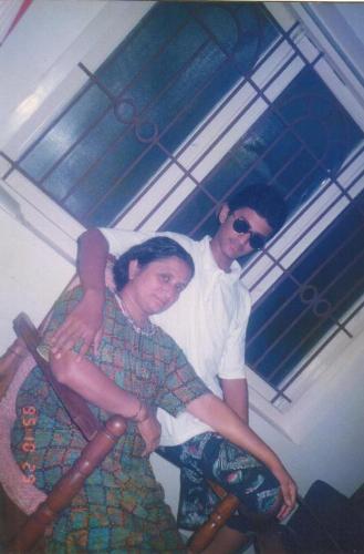 With Amma - In 1995, at our home in Peelaedu, me with my dear mom