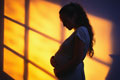 pregnant teenager in the shadows - like theres no future for her
