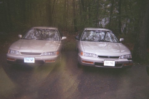 Twin Cars - This is my car alongside a friend of mine's car about 6 hours before I was pulling out of the driveway cut the wheel to soon and ended up hitting his car. OOops