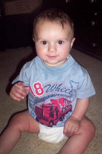 My Son - Heres a photo of my son Kai taken only a few days ago, sitting. I think he looks adorable. Sitting is the new thing, but he has been crawling since he was four months old. I am extremely proud of him.