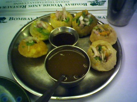 Pani Puri - Pani Puri is a popular street snack in India. It comprises of a round, hollow puri fried crip and filled with a watery mixture of tamarind, chili and potato