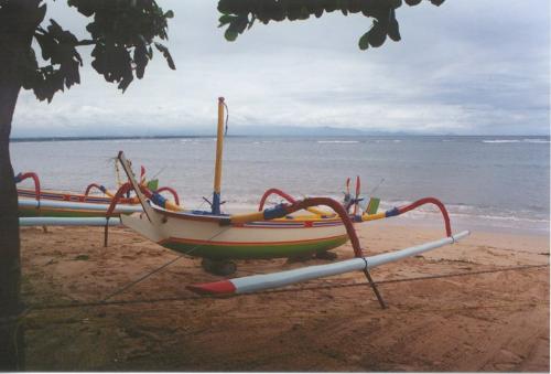 Boats of Sanur Beach, Bali Indonesia - Fishing is a life line to the people of Bali, though they do not eat much themselves, the fish are used in the restuarants serving tourists.