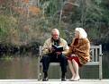 The Notebook -  	 Plot Summary for The Notebook (2004)  The movie focuses on an old man reading a story to an old woman in a nursing home. The story he reads follows two young lovers named Allie Hamilton and Noah Calhoun, who meet one evening at a carnival. But they are separated by Allie's parents who dissaprove of Noah's unwealthy family, and move Allie away. After waiting for Noah to write her for several years, Allie meets and gets engaged to a handsome young soldier named Lon. Allie, then, with her love for Noah still alive, stops by Noah's 200-year-old home that he restored for her, 'to see if he's okay'. It is evident that they still have feelings for each other, and Allie has to choose between her fiancé and her first love.