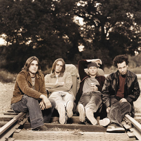 Puddle of Mudd Picture Gallery - One of the first acts signed to Limp Bizkit frontman Fred Durst's label, Flawless Records, was the alt-metal quartet Puddle of Mudd -- consisting of Wesley Reid Scantlin (guitar and vocals), Paul James Phillips (guitar), Douglas John Ardito (bass), and Greg David Upchurch (drums). While their songs expectedly contain the rage of such contemporaries as Korn and Rage Against the Machine, Scantlin's voice at times is eerily similar to Nirvana's late great frontman Kurt Cobain, containing unmistakable elements of traditional hard rock (unlike the other aforementioned band's penchant for rap). August 2001 saw the release of their major label debut, Come Clean (which was preceded by the independent release Abrasive), as they embarked on a European tour with Godsmack a month later, before touring the U.S. as part of the Family Values 2001 tour, alongside Stone Temple Pilots, Linkin Park, and Staind. Greg Prato, All Music Guide