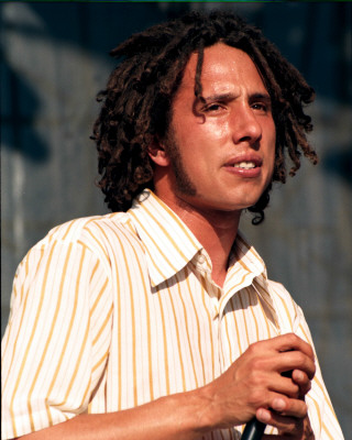 Rage Against the Machine pictures - Rage Against the Machine earned acclaim from disenfranchised fans (and not insignificant derision from critics) for their bombastic, fiercely polemical music, which brewed sloganeering leftist rants against corporate America, cultural imperialism, and government oppression into a Molotov cocktail of punk, hip-hop, and thrash. Rage formed in Los Angeles in the early '90s out of the wreckage of a number of local groups: vocalist Zack de la Rocha (the son of Chicano political artist Beto) emerged from the bands Headstance, Farside, and Inside Out; guitarist Tom Morello (the nephew of Jomo Kenyatta, the first Kenyan president) originated in Lock Up; and drummer Brad Wilk played with future Pearl Jam frontman Eddie Vedder. Rounded out by bassist Tim Bob (aka Tim C., born Tim Commerford), a childhood friend of de la Rocha's, Rage debuted in 1992 with a self-released, self-titled 12-song cassette featuring the song 'Bullet in the Head,' which became a hit when reissued as a single later in the year.