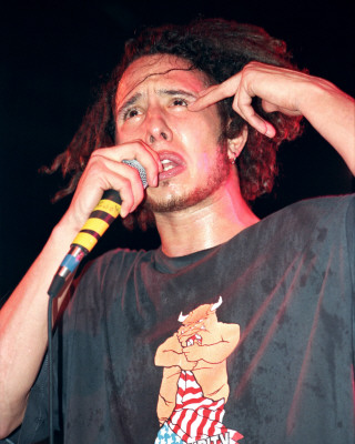 Rage Against the Machine pictures - Rage Against the Machine earned acclaim from disenfranchised fans (and not insignificant derision from critics) for their bombastic, fiercely polemical music, which brewed sloganeering leftist rants against corporate America, cultural imperialism, and government oppression into a Molotov cocktail of punk, hip-hop, and thrash. Rage formed in Los Angeles in the early '90s out of the wreckage of a number of local groups: vocalist Zack de la Rocha (the son of Chicano political artist Beto) emerged from the bands Headstance, Farside, and Inside Out; guitarist Tom Morello (the nephew of Jomo Kenyatta, the first Kenyan president) originated in Lock Up; and drummer Brad Wilk played with future Pearl Jam frontman Eddie Vedder. Rounded out by bassist Tim Bob (aka Tim C., born Tim Commerford), a childhood friend of de la Rocha's, Rage debuted in 1992 with a self-released, self-titled 12-song cassette featuring the song 'Bullet in the Head,' which became a hit when reissued as a single later in the year.