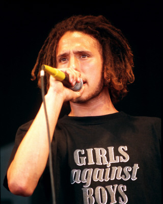 Rage Against the Machine pictures - Rage Against the Machine earned acclaim from disenfranchised fans (and not insignificant derision from critics) for their bombastic, fiercely polemical music, which brewed sloganeering leftist rants against corporate America, cultural imperialism, and government oppression into a Molotov cocktail of punk, hip-hop, and thrash. Rage formed in Los Angeles in the early '90s out of the wreckage of a number of local groups: vocalist Zack de la Rocha (the son of Chicano political artist Beto) emerged from the bands Headstance, Farside, and Inside Out; guitarist Tom Morello (the nephew of Jomo Kenyatta, the first Kenyan president) originated in Lock Up; and drummer Brad Wilk played with future Pearl Jam frontman Eddie Vedder. Rounded out by bassist Tim Bob (aka Tim C., born Tim Commerford), a childhood friend of de la Rocha's, Rage debuted in 1992 with a self-released, self-titled 12-song cassette featuring the song 'Bullet in the Head,' which became a hit when reissued as a single later in the year.