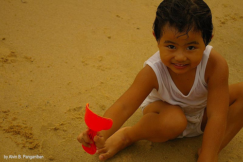 her innocense - my child playing along the seashore at east coast singapore. As she was happily playing with the sand I can see how happy she is with no worries in life. The glow in her eyes everytime she plays and enjoys what nature has given. She is my princess and will forever be my loving daughter.