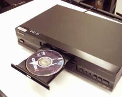 DVD Player w/ DVD - a DVD player with a DVD in it.