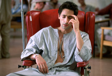The Jacket - After recuperating from a gunshot wound to the head, Gulf War veteran Jack Starks returns to his native Vermont suffering from Amnesia. When he is accused of murdering a police officer and committed to a mental institution, a physician, Dr. Becker, puts him on a controversial treatment regimen in which Starks is injected with experimental drugs, confined in a straight-jacket, and locked for extended periods in the body drawer of the basement morgue. In his drugged and disoriented state, Starks’ mind propels him into the future, where he meets Jackie, and discovers that he is destined to die in four days. Together, they search for a way to save him from his fate.