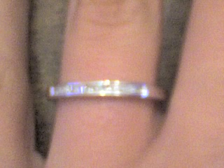 wedding band - this is my wedding band, it has diamond bauguettes embeded in it. And it is 14K white gold. I love it