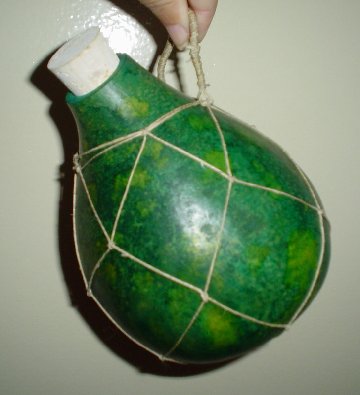 Green gourd with netting. - Just one of the photos of the many art gourds we've done. I'll soon have them on a website at http://www.gourdmania.com