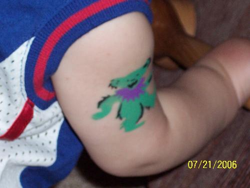 my sons first tattoo - We went to a family day and this was airbrushed on his little arm.