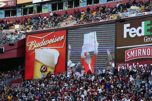 Washington Redskins vs. Phlidephia Eagles pt. 5 - Picture of the jumbo tron and a man dressed in a santa outfit holding up a defense sign.