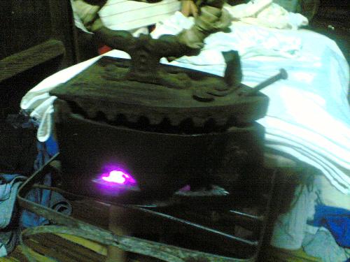 Antique Iron, charcoal operated :)  - This was a working antique Ironing device :) I dnot know in what year this was made but its still working when I take the photo last feb 2006 man this iron is hot :)