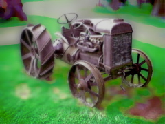 Tractor - old tractor on green grass.
Photoshopped image