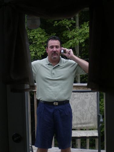Dad - My dad the way we see him most of the time, smiling and on the phone.