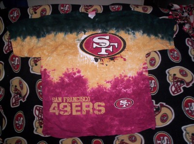 San Francisco 49ers - this is my favorite t-shirt sitting on top of my favorite throw blanket that a friend of mine made for me.  GO NINERS!!!