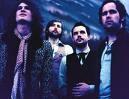 The Killers - The image shows The Killers, who are very big in England, and are a modern rock band, who are all depressed!!