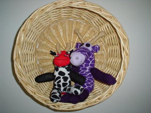 I sell sock critters on Etsy - Cow and giraffe made out of socks.