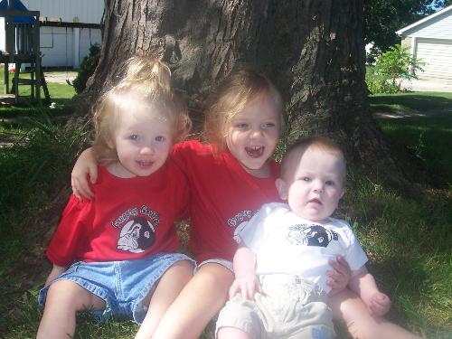 Our kiddos. - Our kiddos sitting in the backyard with their Gregory Gorilla shirts on.