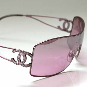 a trend setting glass - Here you see a brand new pair of pink Chanel sunglasses for the year 2006. These sunglasses feature a wide-lens, that is a very fashionable look in the last 2 years. They have two frame arms in a matching pink color, and the signatue Double C's made famous by CoCo Chanel that have diamonds, about 4 Karots worth. This pair of chanel sunglasses retails for $295.00 plus tax