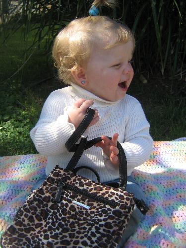 My daughter w/ her Leopard Print purse - cute