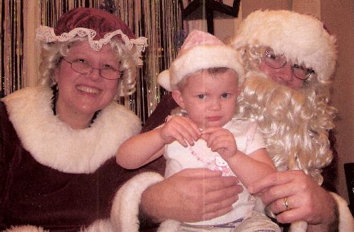my savannah lee and santa claus - This is my Savannah Lee with Santa Claus on the 8th of December at the Bethany Childrens center in Bethany, OK.