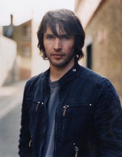 James Blunt picture gallery - Take 'No Bravery', the song that closes his debut album, 'Back to Bedlam', for instance: It was written in Kosovo in 1999, while James was a reconnaissance officer in the British army. On patrol around Pristina, he kept his guitar bolted to the outside of his tank. But in quieter moments, it came out, as he wrote about life as a 22-year-old peacekeeper in the aftermath of one of the decade's bloodiest civil wars. The rest of his unit ordered him to keep the noise down as he wrote and sang in the post-midnight stillness. He didn't keep the noise down. ''No Bravery' is the only complete song I wrote in Kosovo. I wrote it lying by my tank in my sleeping bag with my boots on. You had to sleep with your boots on. The song is pretty fatalistic. The rest of the album is fatalistic,' he says wryly.
