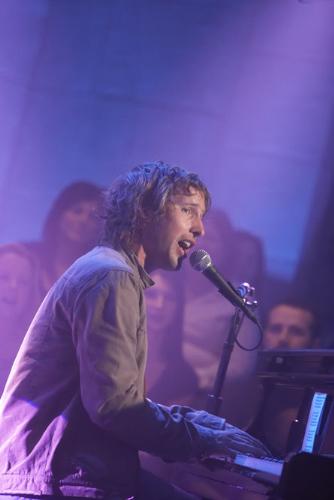 James Blunt picture gallery - Take 'No Bravery', the song that closes his debut album, 'Back to Bedlam', for instance: It was written in Kosovo in 1999, while James was a reconnaissance officer in the British army. On patrol around Pristina, he kept his guitar bolted to the outside of his tank. But in quieter moments, it came out, as he wrote about life as a 22-year-old peacekeeper in the aftermath of one of the decade's bloodiest civil wars. The rest of his unit ordered him to keep the noise down as he wrote and sang in the post-midnight stillness. He didn't keep the noise down. ''No Bravery' is the only complete song I wrote in Kosovo. I wrote it lying by my tank in my sleeping bag with my boots on. You had to sleep with your boots on. The song is pretty fatalistic. The rest of the album is fatalistic,' he says wryly.