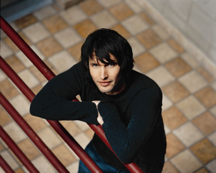 James Blunt picture gallery - Take 'No Bravery', the song that closes his debut album, 'Back to Bedlam', for instance: It was written in Kosovo in 1999, while James was a reconnaissance officer in the British army. On patrol around Pristina, he kept his guitar bolted to the outside of his tank. But in quieter moments, it came out, as he wrote about life as a 22-year-old peacekeeper in the aftermath of one of the decade's bloodiest civil wars. The rest of his unit ordered him to keep the noise down as he wrote and sang in the post-midnight stillness. He didn't keep the noise down. ''No Bravery' is the only complete song I wrote in Kosovo. I wrote it lying by my tank in my sleeping bag with my boots on. You had to sleep with your boots on. The song is pretty fatalistic. The rest of the album is fatalistic,' he says wryly.