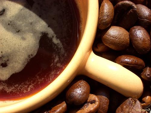 Coffee and its Beans -  Brewed Coffee together with its fresh beans