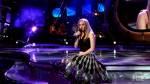 Singing - Carrie Underwood while competing in Ameican Idol.