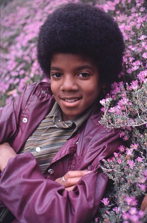 Michael Jackson - Michael Joseph Jackson (born August 29, 1958) is an American musician, entertainer and pop icon, whose successful music career and controversial personal life have been a part of pop culture for the last quarter-century.  Jackson began his musical career at the age of seven as the lead singer of The Jackson 5 and released his first solo recording, Got to Be There in 1971, while remaining a member of the group.[2] He began a full-fledged solo career in 1979 and formally parted with his siblings in 1984.[3] In his solo career, Jackson recorded and co-produced the best-selling album of all time, Thriller, which was named as the world's best-selling album at the 2006 World Music Awards. It has worldwide sales exceeding 104 million.[4] Michael Jackson has received thirteen Grammy awards[5] and charted thirteen number-one singles in the United States.  Throughout his four-decade career, Michael Jackson has been awarded numerous honors including the World Music Award's Best-Selling Pop Male Artist of the Millennium, American Music Award's Artist of the Century Award[6] and the Bambi Award's Pop Artist of the Millennium Award.[7] He is a double-inductee of the Rock and Roll Hall of Fame (once as a member of The Jackson 5 in 1997, and as a solo artist in 2001)[8] and an inductee of the Songwriters Hall of Fame.[9] Raymone Bain, Jackson's PR, claims that Jackson has sold over 750 million units worldwide.[10]  From 1988 to 2005, Jackson lived on his Neverland Ranch property, on which he built an amusement park and private zoo that was frequently attended by disadvantaged and terminally ill children. Rumours of sleepover parties received disparaging media coverage after it was revealed that children frequently slept in his bed or bedroom. These first came to light when he was accused of child sexual abuse in 1993. Michael Jackson's relationship with children was brought into the spotlight again in 2003 during the TV documentary Living with Michael Jackson. This resulted in Jackson being tried, and later acquitted, of more child molestation allegations and several other charges in 2005. Contents [hide] 1 Biography  1.1 1966–1980: Early life and career 1.2 1982–1986: The Thriller era 1.3 1987–1990: Bad and controversies 1.4 1991–1994: Dangerous and further career 1.5 1995–2000: HIStory and Blood on the Dance Floor 1.6 2001–2003: Invincible, Berlin and Martin Bashir 1.7 2003–2006: Trial, acquittal and the aftermath 1.8 2006–present: Visionary, Tokyo and the World Music Awards 2 Discography  2.1 Studio albums 2.2 Number-one singles  2.2.1 US number-one singles 2.2.2 UK number-one singles 3 Filmography  3.1 Notable music videos 3.2 Films 3.3 Videos/DVDs 3.4 Television 3.5 Video games 4 Music samples 5 Further reading 6 References 7 See also  7.1 Michael Jackson articles 7.2 Other related articles 8 External links  Biography  1966–1980: Early life and career Main articles: The Jackson 5 and Off the Wall   The cover to Michael Jackson's 1971's Got to Be There.  Michael Jackson was born in Gary, Indiana. He is the second-youngest brother of seven and the eighth of ten children of Joseph and Katherine Jackson. In 1966, after taking co-lead singing duties with brother Jermaine, the group's name changed from The Jackson Brothers to The Jackson 5. The group played at local clubs and bars, building up a following and eventually signing a contract with Motown Records in 1968.[11] The group hit stardom, with their first four singles which charted at number-one on the Billboard Hot 100. As a solo artist, Jackson released Got to Be There and Ben in 1972. These were released as part of the Jackson 5 franchise and produced successful singles such as 'Got to Be There', 'Ben', and a remake of Bobby Day's 'Rockin' Robin'.  The group's sales declined after 1973, and the group chafed under Motown's strict refusal to allow the Jacksons creative control or input. In 1976, the group signed a new contract with CBS Records (first joining the Philadelphia International division and then Epic Records).[12] When this became apparent to Motown Records, they sued the group for breach of contract.  As a result of the legal proceedings, which were complicated further by the fact that Jermaine Jackson was married to the daughter of Motown president (Berry Gordy), the Jacksons lost the rights to use the 'Jackson 5' name and logo and also Jermaine, who wanted to stay at Motown.[13] They changed their name to 'The Jacksons', featuring youngest brother Randy in Jermaine's place, and continued their successful career, touring internationally and releasing six more albums between 1976 and 1984, with Jermaine eventually re-joining in 1983, making them a sextet.  In 1978, Jackson starred as the scarecrow in The Wiz with former-label mate Diana Ross playing Dorothy.[14] The songs for the musical were arranged by Quincy Jones, who established a partnership with Jackson during the film's production and agreed to produce his first solo album in four years. Off the Wall, released in 1979, was a worldwide hit, and became the first album in history to spawn four top-ten hits, including 'Don't Stop 'Til You Get Enough' and 'Rock with You'.[2]  In January 1980, Jackson won his first awards for his solo efforts at the American Music Awards. He won 'Favorite Soul/R&B Album' (for Off the Wall), 'Favorite Male Soul/R&B Artist' and Favorite Soul/R&B Single (for 'Don't Stop 'Til You Get Enough').[2] Later that month, he also won two Billboard Awards (for 'Top Black Artist' and 'Top Black Album').[2]  On February 27, 1980, Jackson won a Grammy Award for 'Best R&B Vocal Performance, Male' (for 'Don't Stop 'Til You Get Enough').[2]  1982–1986: The Thriller era Main articles: Thriller (album), We Are the World, and Captain EO   The original album cover to 1982's Thriller.  In November 1982, the storybook for E.T.: The Extra-terrestrial was released. It included Jackson reading the story as well as one original song ('Someone in the Dark'). The album later won a Grammy for 'Best Album for Children'.  In December 1982, Jackson released his second Epic album, Thriller, which became the best-selling album in music history. The album spawned seven hit singles, including 'Billie Jean' (which was the first music video by a black artist to receive regular airplay on MTV), 'Beat It' and the album's title track which was accompanied by a revolutionary music video. The thirteen-minute Thriller was critically acclaimed, and massive airplay lead to it being packaged with the featurette Making Michael Jackson's Thriller on VHS, where it became the best-selling music home video ever.[15] Thriller spent 37 weeks at number-one and remained on the Billboard album chart for 122 weeks. It was eventually certified 27x Platinum in the United States.[16]   Jackson with the Reagans in 1984.  In 1983, whilst performing 'Billie Jean' at the Motown 25: Yesterday, Today, Forever concert Jackson debuted what can be regarded as his signature move: the moonwalk.[15] In 1983, he started a sponsorship deal with Pepsi-Cola, and, as part of the deal, he agreed to star in a commercial. While filming a Pepsi commercial with his brothers in 1984, before a live audience, his hair caught on fire when a pyrotechnic effect went wrong. Jackson suffered serious burns on his scalp, which required skin grafts.[17]  In February 1984, Jackson is nominated for twelve Grammy awards and wins eight,[15] breaking the record for the most Grammy Awards won in a single year.[18] Seven were for the critically acclaimed Thriller and the other for the E.T.: The Extra-terrestrial storybook. In 1984, he also won eight American Music Awards and the 'Special Award of Merit' and three MTV Video Music Awards.  After reuniting with his brothers, he then helped to write the Victory album. He then performed and starred in the successful Victory Tour which started on July 6, 1984 and lasted for five months.[15]  In 1985, Jackson was invited to the White House and was personally thanked by then-President Ronald Reagan at a White House ceremony for donating the song 'Beat It' for use in drunk driving prevention television and radio public service announcements.[19]   Jackson continued his charity work in 1985 by co-writing, with Lionel Richie, the hit single 'We Are the World'. The charity single helped to raise money and awareness for the famine in East Africa and was one of the first instances where Jackson was seen as a humanitarian. The song also won a Grammy Award for 'Song of the Year'.[15]   Jackson in the video for 'Beat It'.  Controversy began when Jackson purchased shares in the ATV Music Publishing (a company which owned the rights to most of the Beatles' songs), making himself the majority shareholder. This move angered close friend and songwriter Paul McCartney, who had also made a bid for the company. Ironically, it was McCartney who advised Jackson on the merits of song ownership.[20] Their creative co-writing ended after this event. Following this controversial business deal, tabloid stories of Jackson sleeping in a hyperbaric oxygen chamber to stall the aging-process, and an allegation claiming Jackson attempted to purchase the bones of the Elephant Man inspired the pejorative nickname 'Wacko Jacko'. The name 'Wacko Jacko' would come to be detested by Jackson.[21]  In 1986, Jackson starred in the George Lucas-produced, Francis Ford Coppola-directed 3-D film Captain EO. The film lasted 17 minutes but had costs estimated at $17 million.[22] At the time, it was the most expensive film ever produced on a per-minute basis. In the USA, the Disney theme parks hosted Captain EO. Disneyland featured the film in tomorrow-land from September 18, 1986 until April 7, 1997. It was also featured in Walt Disney World in Epcot from September 12, 1986 until July 6, 1994. Two new songs featured in the film. These were 'Another Part of Me', which later appeared on Bad, and 'We