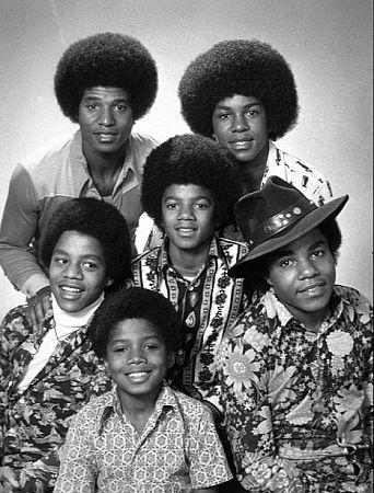 Michael Jackson - Michael Joseph Jackson (born August 29, 1958) is an American musician, entertainer and pop icon, whose successful music career and controversial personal life have been a part of pop culture for the last quarter-century.  Jackson began his musical career at the age of seven as the lead singer of The Jackson 5 and released his first solo recording, Got to Be There in 1971, while remaining a member of the group.[2] He began a full-fledged solo career in 1979 and formally parted with his siblings in 1984.[3] In his solo career, Jackson recorded and co-produced the best-selling album of all time, Thriller, which was named as the world's best-selling album at the 2006 World Music Awards. It has worldwide sales exceeding 104 million.[4] Michael Jackson has received thirteen Grammy awards[5] and charted thirteen number-one singles in the United States.  Throughout his four-decade career, Michael Jackson has been awarded numerous honors including the World Music Award's Best-Selling Pop Male Artist of the Millennium, American Music Award's Artist of the Century Award[6] and the Bambi Award's Pop Artist of the Millennium Award.[7] He is a double-inductee of the Rock and Roll Hall of Fame (once as a member of The Jackson 5 in 1997, and as a solo artist in 2001)[8] and an inductee of the Songwriters Hall of Fame.[9] Raymone Bain, Jackson's PR, claims that Jackson has sold over 750 million units worldwide.[10]  From 1988 to 2005, Jackson lived on his Neverland Ranch property, on which he built an amusement park and private zoo that was frequently attended by disadvantaged and terminally ill children. Rumours of sleepover parties received disparaging media coverage after it was revealed that children frequently slept in his bed or bedroom. These first came to light when he was accused of child sexual abuse in 1993. Michael Jackson's relationship with children was brought into the spotlight again in 2003 during the TV documentary Living with Michael Jackson. This resulted in Jackson being tried, and later acquitted, of more child molestation allegations and several other charges in 2005. Contents [hide] 1 Biography  1.1 1966–1980: Early life and career 1.2 1982–1986: The Thriller era 1.3 1987–1990: Bad and controversies 1.4 1991–1994: Dangerous and further career 1.5 1995–2000: HIStory and Blood on the Dance Floor 1.6 2001–2003: Invincible, Berlin and Martin Bashir 1.7 2003–2006: Trial, acquittal and the aftermath 1.8 2006–present: Visionary, Tokyo and the World Music Awards 2 Discography  2.1 Studio albums 2.2 Number-one singles  2.2.1 US number-one singles 2.2.2 UK number-one singles 3 Filmography  3.1 Notable music videos 3.2 Films 3.3 Videos/DVDs 3.4 Television 3.5 Video games 4 Music samples 5 Further reading 6 References 7 See also  7.1 Michael Jackson articles 7.2 Other related articles 8 External links  Biography  1966–1980: Early life and career Main articles: The Jackson 5 and Off the Wall   The cover to Michael Jackson's 1971's Got to Be There.  Michael Jackson was born in Gary, Indiana. He is the second-youngest brother of seven and the eighth of ten children of Joseph and Katherine Jackson. In 1966, after taking co-lead singing duties with brother Jermaine, the group's name changed from The Jackson Brothers to The Jackson 5. The group played at local clubs and bars, building up a following and eventually signing a contract with Motown Records in 1968.[11] The group hit stardom, with their first four singles which charted at number-one on the Billboard Hot 100. As a solo artist, Jackson released Got to Be There and Ben in 1972. These were released as part of the Jackson 5 franchise and produced successful singles such as 'Got to Be There', 'Ben', and a remake of Bobby Day's 'Rockin' Robin'.  The group's sales declined after 1973, and the group chafed under Motown's strict refusal to allow the Jacksons creative control or input. In 1976, the group signed a new contract with CBS Records (first joining the Philadelphia International division and then Epic Records).[12] When this became apparent to Motown Records, they sued the group for breach of contract.  As a result of the legal proceedings, which were complicated further by the fact that Jermaine Jackson was married to the daughter of Motown president (Berry Gordy), the Jacksons lost the rights to use the 'Jackson 5' name and logo and also Jermaine, who wanted to stay at Motown.[13] They changed their name to 'The Jacksons', featuring youngest brother Randy in Jermaine's place, and continued their successful career, touring internationally and releasing six more albums between 1976 and 1984, with Jermaine eventually re-joining in 1983, making them a sextet.  In 1978, Jackson starred as the scarecrow in The Wiz with former-label mate Diana Ross playing Dorothy.[14] The songs for the musical were arranged by Quincy Jones, who established a partnership with Jackson during the film's production and agreed to produce his first solo album in four years. Off the Wall, released in 1979, was a worldwide hit, and became the first album in history to spawn four top-ten hits, including 'Don't Stop 'Til You Get Enough' and 'Rock with You'.[2]  In January 1980, Jackson won his first awards for his solo efforts at the American Music Awards. He won 'Favorite Soul/R&B Album' (for Off the Wall), 'Favorite Male Soul/R&B Artist' and Favorite Soul/R&B Single (for 'Don't Stop 'Til You Get Enough').[2] Later that month, he also won two Billboard Awards (for 'Top Black Artist' and 'Top Black Album').[2]  On February 27, 1980, Jackson won a Grammy Award for 'Best R&B Vocal Performance, Male' (for 'Don't Stop 'Til You Get Enough').[2]  1982–1986: The Thriller era Main articles: Thriller (album), We Are the World, and Captain EO   The original album cover to 1982's Thriller.  In November 1982, the storybook for E.T.: The Extra-terrestrial was released. It included Jackson reading the story as well as one original song ('Someone in the Dark'). The album later won a Grammy for 'Best Album for Children'.  In December 1982, Jackson released his second Epic album, Thriller, which became the best-selling album in music history. The album spawned seven hit singles, including 'Billie Jean' (which was the first music video by a black artist to receive regular airplay on MTV), 'Beat It' and the album's title track which was accompanied by a revolutionary music video. The thirteen-minute Thriller was critically acclaimed, and massive airplay lead to it being packaged with the featurette Making Michael Jackson's Thriller on VHS, where it became the best-selling music home video ever.[15] Thriller spent 37 weeks at number-one and remained on the Billboard album chart for 122 weeks. It was eventually certified 27x Platinum in the United States.[16]   Jackson with the Reagans in 1984.  In 1983, whilst performing 'Billie Jean' at the Motown 25: Yesterday, Today, Forever concert Jackson debuted what can be regarded as his signature move: the moonwalk.[15] In 1983, he started a sponsorship deal with Pepsi-Cola, and, as part of the deal, he agreed to star in a commercial. While filming a Pepsi commercial with his brothers in 1984, before a live audience, his hair caught on fire when a pyrotechnic effect went wrong. Jackson suffered serious burns on his scalp, which required skin grafts.[17]  In February 1984, Jackson is nominated for twelve Grammy awards and wins eight,[15] breaking the record for the most Grammy Awards won in a single year.[18] Seven were for the critically acclaimed Thriller and the other for the E.T.: The Extra-terrestrial storybook. In 1984, he also won eight American Music Awards and the 'Special Award of Merit' and three MTV Video Music Awards.  After reuniting with his brothers, he then helped to write the Victory album. He then performed and starred in the successful Victory Tour which started on July 6, 1984 and lasted for five months.[15]  In 1985, Jackson was invited to the White House and was personally thanked by then-President Ronald Reagan at a White House ceremony for donating the song 'Beat It' for use in drunk driving prevention television and radio public service announcements.[19]   Jackson continued his charity work in 1985 by co-writing, with Lionel Richie, the hit single 'We Are the World'. The charity single helped to raise money and awareness for the famine in East Africa and was one of the first instances where Jackson was seen as a humanitarian. The song also won a Grammy Award for 'Song of the Year'.[15]   Jackson in the video for 'Beat It'.  Controversy began when Jackson purchased shares in the ATV Music Publishing (a company which owned the rights to most of the Beatles' songs), making himself the majority shareholder. This move angered close friend and songwriter Paul McCartney, who had also made a bid for the company. Ironically, it was McCartney who advised Jackson on the merits of song ownership.[20] Their creative co-writing ended after this event. Following this controversial business deal, tabloid stories of Jackson sleeping in a hyperbaric oxygen chamber to stall the aging-process, and an allegation claiming Jackson attempted to purchase the bones of the Elephant Man inspired the pejorative nickname 'Wacko Jacko'. The name 'Wacko Jacko' would come to be detested by Jackson.[21]  In 1986, Jackson starred in the George Lucas-produced, Francis Ford Coppola-directed 3-D film Captain EO. The film lasted 17 minutes but had costs estimated at $17 million.[22] At the time, it was the most expensive film ever produced on a per-minute basis. In the USA, the Disney theme parks hosted Captain EO. Disneyland featured the film in tomorrow-land from September 18, 1986 until April 7, 1997. It was also featured in Walt Disney World in Epcot from September 12, 1986 until July 6, 1994. Two new songs featured in the film. These were 'Another Part of Me', which later appeared on Bad, and 'We