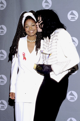 Michael Jackson - Michael Joseph Jackson (born August 29, 1958) is an American musician, entertainer and pop icon, whose successful music career and controversial personal life have been a part of pop culture for the last quarter-century.  Jackson began his musical career at the age of seven as the lead singer of The Jackson 5 and released his first solo recording, Got to Be There in 1971, while remaining a member of the group.[2] He began a full-fledged solo career in 1979 and formally parted with his siblings in 1984.[3] In his solo career, Jackson recorded and co-produced the best-selling album of all time, Thriller, which was named as the world's best-selling album at the 2006 World Music Awards. It has worldwide sales exceeding 104 million.[4] Michael Jackson has received thirteen Grammy awards[5] and charted thirteen number-one singles in the United States.  Throughout his four-decade career, Michael Jackson has been awarded numerous honors including the World Music Award's Best-Selling Pop Male Artist of the Millennium, American Music Award's Artist of the Century Award[6] and the Bambi Award's Pop Artist of the Millennium Award.[7] He is a double-inductee of the Rock and Roll Hall of Fame (once as a member of The Jackson 5 in 1997, and as a solo artist in 2001)[8] and an inductee of the Songwriters Hall of Fame.[9] Raymone Bain, Jackson's PR, claims that Jackson has sold over 750 million units worldwide.[10]  From 1988 to 2005, Jackson lived on his Neverland Ranch property, on which he built an amusement park and private zoo that was frequently attended by disadvantaged and terminally ill children. Rumours of sleepover parties received disparaging media coverage after it was revealed that children frequently slept in his bed or bedroom. These first came to light when he was accused of child sexual abuse in 1993. Michael Jackson's relationship with children was brought into the spotlight again in 2003 during the TV documentary Living with Michael Jackson. This resulted in Jackson being tried, and later acquitted, of more child molestation allegations and several other charges in 2005. Contents [hide] 1 Biography  1.1 1966–1980: Early life and career 1.2 1982–1986: The Thriller era 1.3 1987–1990: Bad and controversies 1.4 1991–1994: Dangerous and further career 1.5 1995–2000: HIStory and Blood on the Dance Floor 1.6 2001–2003: Invincible, Berlin and Martin Bashir 1.7 2003–2006: Trial, acquittal and the aftermath 1.8 2006–present: Visionary, Tokyo and the World Music Awards 2 Discography  2.1 Studio albums 2.2 Number-one singles  2.2.1 US number-one singles 2.2.2 UK number-one singles 3 Filmography  3.1 Notable music videos 3.2 Films 3.3 Videos/DVDs 3.4 Television 3.5 Video games 4 Music samples 5 Further reading 6 References 7 See also  7.1 Michael Jackson articles 7.2 Other related articles 8 External links  Biography  1966–1980: Early life and career Main articles: The Jackson 5 and Off the Wall   The cover to Michael Jackson's 1971's Got to Be There.  Michael Jackson was born in Gary, Indiana. He is the second-youngest brother of seven and the eighth of ten children of Joseph and Katherine Jackson. In 1966, after taking co-lead singing duties with brother Jermaine, the group's name changed from The Jackson Brothers to The Jackson 5. The group played at local clubs and bars, building up a following and eventually signing a contract with Motown Records in 1968.[11] The group hit stardom, with their first four singles which charted at number-one on the Billboard Hot 100. As a solo artist, Jackson released Got to Be There and Ben in 1972. These were released as part of the Jackson 5 franchise and produced successful singles such as 'Got to Be There', 'Ben', and a remake of Bobby Day's 'Rockin' Robin'.  The group's sales declined after 1973, and the group chafed under Motown's strict refusal to allow the Jacksons creative control or input. In 1976, the group signed a new contract with CBS Records (first joining the Philadelphia International division and then Epic Records).[12] When this became apparent to Motown Records, they sued the group for breach of contract.  As a result of the legal proceedings, which were complicated further by the fact that Jermaine Jackson was married to the daughter of Motown president (Berry Gordy), the Jacksons lost the rights to use the 'Jackson 5' name and logo and also Jermaine, who wanted to stay at Motown.[13] They changed their name to 'The Jacksons', featuring youngest brother Randy in Jermaine's place, and continued their successful career, touring internationally and releasing six more albums between 1976 and 1984, with Jermaine eventually re-joining in 1983, making them a sextet.  In 1978, Jackson starred as the scarecrow in The Wiz with former-label mate Diana Ross playing Dorothy.[14] The songs for the musical were arranged by Quincy Jones, who established a partnership with Jackson during the film's production and agreed to produce his first solo album in four years. Off the Wall, released in 1979, was a worldwide hit, and became the first album in history to spawn four top-ten hits, including 'Don't Stop 'Til You Get Enough' and 'Rock with You'.[2]  In January 1980, Jackson won his first awards for his solo efforts at the American Music Awards. He won 'Favorite Soul/R&B Album' (for Off the Wall), 'Favorite Male Soul/R&B Artist' and Favorite Soul/R&B Single (for 'Don't Stop 'Til You Get Enough').[2] Later that month, he also won two Billboard Awards (for 'Top Black Artist' and 'Top Black Album').[2]  On February 27, 1980, Jackson won a Grammy Award for 'Best R&B Vocal Performance, Male' (for 'Don't Stop 'Til You Get Enough').[2]  1982–1986: The Thriller era Main articles: Thriller (album), We Are the World, and Captain EO   The original album cover to 1982's Thriller.  In November 1982, the storybook for E.T.: The Extra-terrestrial was released. It included Jackson reading the story as well as one original song ('Someone in the Dark'). The album later won a Grammy for 'Best Album for Children'.  In December 1982, Jackson released his second Epic album, Thriller, which became the best-selling album in music history. The album spawned seven hit singles, including 'Billie Jean' (which was the first music video by a black artist to receive regular airplay on MTV), 'Beat It' and the album's title track which was accompanied by a revolutionary music video. The thirteen-minute Thriller was critically acclaimed, and massive airplay lead to it being packaged with the featurette Making Michael Jackson's Thriller on VHS, where it became the best-selling music home video ever.[15] Thriller spent 37 weeks at number-one and remained on the Billboard album chart for 122 weeks. It was eventually certified 27x Platinum in the United States.[16]   Jackson with the Reagans in 1984.  In 1983, whilst performing 'Billie Jean' at the Motown 25: Yesterday, Today, Forever concert Jackson debuted what can be regarded as his signature move: the moonwalk.[15] In 1983, he started a sponsorship deal with Pepsi-Cola, and, as part of the deal, he agreed to star in a commercial. While filming a Pepsi commercial with his brothers in 1984, before a live audience, his hair caught on fire when a pyrotechnic effect went wrong. Jackson suffered serious burns on his scalp, which required skin grafts.[17]  In February 1984, Jackson is nominated for twelve Grammy awards and wins eight,[15] breaking the record for the most Grammy Awards won in a single year.[18] Seven were for the critically acclaimed Thriller and the other for the E.T.: The Extra-terrestrial storybook. In 1984, he also won eight American Music Awards and the 'Special Award of Merit' and three MTV Video Music Awards.  After reuniting with his brothers, he then helped to write the Victory album. He then performed and starred in the successful Victory Tour which started on July 6, 1984 and lasted for five months.[15]  In 1985, Jackson was invited to the White House and was personally thanked by then-President Ronald Reagan at a White House ceremony for donating the song 'Beat It' for use in drunk driving prevention television and radio public service announcements.[19]   Jackson continued his charity work in 1985 by co-writing, with Lionel Richie, the hit single 'We Are the World'. The charity single helped to raise money and awareness for the famine in East Africa and was one of the first instances where Jackson was seen as a humanitarian. The song also won a Grammy Award for 'Song of the Year'.[15]   Jackson in the video for 'Beat It'.  Controversy began when Jackson purchased shares in the ATV Music Publishing (a company which owned the rights to most of the Beatles' songs), making himself the majority shareholder. This move angered close friend and songwriter Paul McCartney, who had also made a bid for the company. Ironically, it was McCartney who advised Jackson on the merits of song ownership.[20] Their creative co-writing ended after this event. Following this controversial business deal, tabloid stories of Jackson sleeping in a hyperbaric oxygen chamber to stall the aging-process, and an allegation claiming Jackson attempted to purchase the bones of the Elephant Man inspired the pejorative nickname 'Wacko Jacko'. The name 'Wacko Jacko' would come to be detested by Jackson.[21]  In 1986, Jackson starred in the George Lucas-produced, Francis Ford Coppola-directed 3-D film Captain EO. The film lasted 17 minutes but had costs estimated at $17 million.[22] At the time, it was the most expensive film ever produced on a per-minute basis. In the USA, the Disney theme parks hosted Captain EO. Disneyland featured the film in tomorrow-land from September 18, 1986 until April 7, 1997. It was also featured in Walt Disney World in Epcot from September 12, 1986 until July 6, 1994. Two new songs featured in the film. These were 'Another Part of Me', which later appeared on Bad, and 'We