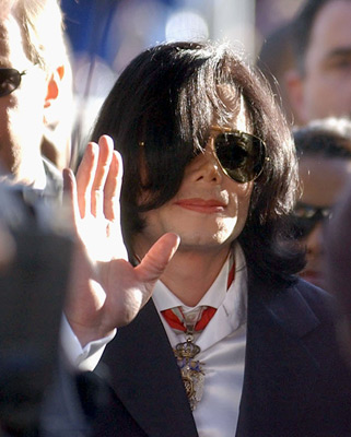 Michael Jackson - Michael Joseph Jackson (born August 29, 1958) is an American musician, entertainer and pop icon, whose successful music career and controversial personal life have been a part of pop culture for the last quarter-century.  Jackson began his musical career at the age of seven as the lead singer of The Jackson 5 and released his first solo recording, Got to Be There in 1971, while remaining a member of the group.[2] He began a full-fledged solo career in 1979 and formally parted with his siblings in 1984.[3] In his solo career, Jackson recorded and co-produced the best-selling album of all time, Thriller, which was named as the world's best-selling album at the 2006 World Music Awards. It has worldwide sales exceeding 104 million.[4] Michael Jackson has received thirteen Grammy awards[5] and charted thirteen number-one singles in the United States.  Throughout his four-decade career, Michael Jackson has been awarded numerous honors including the World Music Award's Best-Selling Pop Male Artist of the Millennium, American Music Award's Artist of the Century Award[6] and the Bambi Award's Pop Artist of the Millennium Award.[7] He is a double-inductee of the Rock and Roll Hall of Fame (once as a member of The Jackson 5 in 1997, and as a solo artist in 2001)[8] and an inductee of the Songwriters Hall of Fame.[9] Raymone Bain, Jackson's PR, claims that Jackson has sold over 750 million units worldwide.[10]  From 1988 to 2005, Jackson lived on his Neverland Ranch property, on which he built an amusement park and private zoo that was frequently attended by disadvantaged and terminally ill children. Rumours of sleepover parties received disparaging media coverage after it was revealed that children frequently slept in his bed or bedroom. These first came to light when he was accused of child sexual abuse in 1993. Michael Jackson's relationship with children was brought into the spotlight again in 2003 during the TV documentary Living with Michael Jackson. This resulted in Jackson being tried, and later acquitted, of more child molestation allegations and several other charges in 2005. Contents [hide] 1 Biography  1.1 1966–1980: Early life and career 1.2 1982–1986: The Thriller era 1.3 1987–1990: Bad and controversies 1.4 1991–1994: Dangerous and further career 1.5 1995–2000: HIStory and Blood on the Dance Floor 1.6 2001–2003: Invincible, Berlin and Martin Bashir 1.7 2003–2006: Trial, acquittal and the aftermath 1.8 2006–present: Visionary, Tokyo and the World Music Awards 2 Discography  2.1 Studio albums 2.2 Number-one singles  2.2.1 US number-one singles 2.2.2 UK number-one singles 3 Filmography  3.1 Notable music videos 3.2 Films 3.3 Videos/DVDs 3.4 Television 3.5 Video games 4 Music samples 5 Further reading 6 References 7 See also  7.1 Michael Jackson articles 7.2 Other related articles 8 External links  Biography  1966–1980: Early life and career Main articles: The Jackson 5 and Off the Wall   The cover to Michael Jackson's 1971's Got to Be There.  Michael Jackson was born in Gary, Indiana. He is the second-youngest brother of seven and the eighth of ten children of Joseph and Katherine Jackson. In 1966, after taking co-lead singing duties with brother Jermaine, the group's name changed from The Jackson Brothers to The Jackson 5. The group played at local clubs and bars, building up a following and eventually signing a contract with Motown Records in 1968.[11] The group hit stardom, with their first four singles which charted at number-one on the Billboard Hot 100. As a solo artist, Jackson released Got to Be There and Ben in 1972. These were released as part of the Jackson 5 franchise and produced successful singles such as 'Got to Be There', 'Ben', and a remake of Bobby Day's 'Rockin' Robin'.  The group's sales declined after 1973, and the group chafed under Motown's strict refusal to allow the Jacksons creative control or input. In 1976, the group signed a new contract with CBS Records (first joining the Philadelphia International division and then Epic Records).[12] When this became apparent to Motown Records, they sued the group for breach of contract.  As a result of the legal proceedings, which were complicated further by the fact that Jermaine Jackson was married to the daughter of Motown president (Berry Gordy), the Jacksons lost the rights to use the 'Jackson 5' name and logo and also Jermaine, who wanted to stay at Motown.[13] They changed their name to 'The Jacksons', featuring youngest brother Randy in Jermaine's place, and continued their successful career, touring internationally and releasing six more albums between 1976 and 1984, with Jermaine eventually re-joining in 1983, making them a sextet.  In 1978, Jackson starred as the scarecrow in The Wiz with former-label mate Diana Ross playing Dorothy.[14] The songs for the musical were arranged by Quincy Jones, who established a partnership with Jackson during the film's production and agreed to produce his first solo album in four years. Off the Wall, released in 1979, was a worldwide hit, and became the first album in history to spawn four top-ten hits, including 'Don't Stop 'Til You Get Enough' and 'Rock with You'.[2]  In January 1980, Jackson won his first awards for his solo efforts at the American Music Awards. He won 'Favorite Soul/R&B Album' (for Off the Wall), 'Favorite Male Soul/R&B Artist' and Favorite Soul/R&B Single (for 'Don't Stop 'Til You Get Enough').[2] Later that month, he also won two Billboard Awards (for 'Top Black Artist' and 'Top Black Album').[2]  On February 27, 1980, Jackson won a Grammy Award for 'Best R&B Vocal Performance, Male' (for 'Don't Stop 'Til You Get Enough').[2]  1982–1986: The Thriller era Main articles: Thriller (album), We Are the World, and Captain EO   The original album cover to 1982's Thriller.  In November 1982, the storybook for E.T.: The Extra-terrestrial was released. It included Jackson reading the story as well as one original song ('Someone in the Dark'). The album later won a Grammy for 'Best Album for Children'.  In December 1982, Jackson released his second Epic album, Thriller, which became the best-selling album in music history. The album spawned seven hit singles, including 'Billie Jean' (which was the first music video by a black artist to receive regular airplay on MTV), 'Beat It' and the album's title track which was accompanied by a revolutionary music video. The thirteen-minute Thriller was critically acclaimed, and massive airplay lead to it being packaged with the featurette Making Michael Jackson's Thriller on VHS, where it became the best-selling music home video ever.[15] Thriller spent 37 weeks at number-one and remained on the Billboard album chart for 122 weeks. It was eventually certified 27x Platinum in the United States.[16]   Jackson with the Reagans in 1984.  In 1983, whilst performing 'Billie Jean' at the Motown 25: Yesterday, Today, Forever concert Jackson debuted what can be regarded as his signature move: the moonwalk.[15] In 1983, he started a sponsorship deal with Pepsi-Cola, and, as part of the deal, he agreed to star in a commercial. While filming a Pepsi commercial with his brothers in 1984, before a live audience, his hair caught on fire when a pyrotechnic effect went wrong. Jackson suffered serious burns on his scalp, which required skin grafts.[17]  In February 1984, Jackson is nominated for twelve Grammy awards and wins eight,[15] breaking the record for the most Grammy Awards won in a single year.[18] Seven were for the critically acclaimed Thriller and the other for the E.T.: The Extra-terrestrial storybook. In 1984, he also won eight American Music Awards and the 'Special Award of Merit' and three MTV Video Music Awards.  After reuniting with his brothers, he then helped to write the Victory album. He then performed and starred in the successful Victory Tour which started on July 6, 1984 and lasted for five months.[15]  In 1985, Jackson was invited to the White House and was personally thanked by then-President Ronald Reagan at a White House ceremony for donating the song 'Beat It' for use in drunk driving prevention television and radio public service announcements.[19]   Jackson continued his charity work in 1985 by co-writing, with Lionel Richie, the hit single 'We Are the World'. The charity single helped to raise money and awareness for the famine in East Africa and was one of the first instances where Jackson was seen as a humanitarian. The song also won a Grammy Award for 'Song of the Year'.[15]   Jackson in the video for 'Beat It'.  Controversy began when Jackson purchased shares in the ATV Music Publishing (a company which owned the rights to most of the Beatles' songs), making himself the majority shareholder. This move angered close friend and songwriter Paul McCartney, who had also made a bid for the company. Ironically, it was McCartney who advised Jackson on the merits of song ownership.[20] Their creative co-writing ended after this event. Following this controversial business deal, tabloid stories of Jackson sleeping in a hyperbaric oxygen chamber to stall the aging-process, and an allegation claiming Jackson attempted to purchase the bones of the Elephant Man inspired the pejorative nickname 'Wacko Jacko'. The name 'Wacko Jacko' would come to be detested by Jackson.[21]  In 1986, Jackson starred in the George Lucas-produced, Francis Ford Coppola-directed 3-D film Captain EO. The film lasted 17 minutes but had costs estimated at $17 million.[22] At the time, it was the most expensive film ever produced on a per-minute basis. In the USA, the Disney theme parks hosted Captain EO. Disneyland featured the film in tomorrow-land from September 18, 1986 until April 7, 1997. It was also featured in Walt Disney World in Epcot from September 12, 1986 until July 6, 1994. Two new songs featured in the film. These were 'Another Part of Me', which later appeared on Bad, and 'We