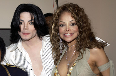 Michael Jackson - Michael Joseph Jackson (born August 29, 1958) is an American musician, entertainer and pop icon, whose successful music career and controversial personal life have been a part of pop culture for the last quarter-century.  Jackson began his musical career at the age of seven as the lead singer of The Jackson 5 and released his first solo recording, Got to Be There in 1971, while remaining a member of the group.[2] He began a full-fledged solo career in 1979 and formally parted with his siblings in 1984.[3] In his solo career, Jackson recorded and co-produced the best-selling album of all time, Thriller, which was named as the world's best-selling album at the 2006 World Music Awards. It has worldwide sales exceeding 104 million.[4] Michael Jackson has received thirteen Grammy awards[5] and charted thirteen number-one singles in the United States.  Throughout his four-decade career, Michael Jackson has been awarded numerous honors including the World Music Award's Best-Selling Pop Male Artist of the Millennium, American Music Award's Artist of the Century Award[6] and the Bambi Award's Pop Artist of the Millennium Award.[7] He is a double-inductee of the Rock and Roll Hall of Fame (once as a member of The Jackson 5 in 1997, and as a solo artist in 2001)[8] and an inductee of the Songwriters Hall of Fame.[9] Raymone Bain, Jackson's PR, claims that Jackson has sold over 750 million units worldwide.[10]  From 1988 to 2005, Jackson lived on his Neverland Ranch property, on which he built an amusement park and private zoo that was frequently attended by disadvantaged and terminally ill children. Rumours of sleepover parties received disparaging media coverage after it was revealed that children frequently slept in his bed or bedroom. These first came to light when he was accused of child sexual abuse in 1993. Michael Jackson's relationship with children was brought into the spotlight again in 2003 during the TV documentary Living with Michael Jackson. This resulted in Jackson being tried, and later acquitted, of more child molestation allegations and several other charges in 2005. Contents [hide] 1 Biography  1.1 1966–1980: Early life and career 1.2 1982–1986: The Thriller era 1.3 1987–1990: Bad and controversies 1.4 1991–1994: Dangerous and further career 1.5 1995–2000: HIStory and Blood on the Dance Floor 1.6 2001–2003: Invincible, Berlin and Martin Bashir 1.7 2003–2006: Trial, acquittal and the aftermath 1.8 2006–present: Visionary, Tokyo and the World Music Awards 2 Discography  2.1 Studio albums 2.2 Number-one singles  2.2.1 US number-one singles 2.2.2 UK number-one singles 3 Filmography  3.1 Notable music videos 3.2 Films 3.3 Videos/DVDs 3.4 Television 3.5 Video games 4 Music samples 5 Further reading 6 References 7 See also  7.1 Michael Jackson articles 7.2 Other related articles 8 External links  Biography  1966–1980: Early life and career Main articles: The Jackson 5 and Off the Wall   The cover to Michael Jackson's 1971's Got to Be There.  Michael Jackson was born in Gary, Indiana. He is the second-youngest brother of seven and the eighth of ten children of Joseph and Katherine Jackson. In 1966, after taking co-lead singing duties with brother Jermaine, the group's name changed from The Jackson Brothers to The Jackson 5. The group played at local clubs and bars, building up a following and eventually signing a contract with Motown Records in 1968.[11] The group hit stardom, with their first four singles which charted at number-one on the Billboard Hot 100. As a solo artist, Jackson released Got to Be There and Ben in 1972. These were released as part of the Jackson 5 franchise and produced successful singles such as 'Got to Be There', 'Ben', and a remake of Bobby Day's 'Rockin' Robin'.  The group's sales declined after 1973, and the group chafed under Motown's strict refusal to allow the Jacksons creative control or input. In 1976, the group signed a new contract with CBS Records (first joining the Philadelphia International division and then Epic Records).[12] When this became apparent to Motown Records, they sued the group for breach of contract.  As a result of the legal proceedings, which were complicated further by the fact that Jermaine Jackson was married to the daughter of Motown president (Berry Gordy), the Jacksons lost the rights to use the 'Jackson 5' name and logo and also Jermaine, who wanted to stay at Motown.[13] They changed their name to 'The Jacksons', featuring youngest brother Randy in Jermaine's place, and continued their successful career, touring internationally and releasing six more albums between 1976 and 1984, with Jermaine eventually re-joining in 1983, making them a sextet.  In 1978, Jackson starred as the scarecrow in The Wiz with former-label mate Diana Ross playing Dorothy.[14] The songs for the musical were arranged by Quincy Jones, who established a partnership with Jackson during the film's production and agreed to produce his first solo album in four years. Off the Wall, released in 1979, was a worldwide hit, and became the first album in history to spawn four top-ten hits, including 'Don't Stop 'Til You Get Enough' and 'Rock with You'.[2]  In January 1980, Jackson won his first awards for his solo efforts at the American Music Awards. He won 'Favorite Soul/R&B Album' (for Off the Wall), 'Favorite Male Soul/R&B Artist' and Favorite Soul/R&B Single (for 'Don't Stop 'Til You Get Enough').[2] Later that month, he also won two Billboard Awards (for 'Top Black Artist' and 'Top Black Album').[2]  On February 27, 1980, Jackson won a Grammy Award for 'Best R&B Vocal Performance, Male' (for 'Don't Stop 'Til You Get Enough').[2]  1982–1986: The Thriller era Main articles: Thriller (album), We Are the World, and Captain EO   The original album cover to 1982's Thriller.  In November 1982, the storybook for E.T.: The Extra-terrestrial was released. It included Jackson reading the story as well as one original song ('Someone in the Dark'). The album later won a Grammy for 'Best Album for Children'.  In December 1982, Jackson released his second Epic album, Thriller, which became the best-selling album in music history. The album spawned seven hit singles, including 'Billie Jean' (which was the first music video by a black artist to receive regular airplay on MTV), 'Beat It' and the album's title track which was accompanied by a revolutionary music video. The thirteen-minute Thriller was critically acclaimed, and massive airplay lead to it being packaged with the featurette Making Michael Jackson's Thriller on VHS, where it became the best-selling music home video ever.[15] Thriller spent 37 weeks at number-one and remained on the Billboard album chart for 122 weeks. It was eventually certified 27x Platinum in the United States.[16]   Jackson with the Reagans in 1984.  In 1983, whilst performing 'Billie Jean' at the Motown 25: Yesterday, Today, Forever concert Jackson debuted what can be regarded as his signature move: the moonwalk.[15] In 1983, he started a sponsorship deal with Pepsi-Cola, and, as part of the deal, he agreed to star in a commercial. While filming a Pepsi commercial with his brothers in 1984, before a live audience, his hair caught on fire when a pyrotechnic effect went wrong. Jackson suffered serious burns on his scalp, which required skin grafts.[17]  In February 1984, Jackson is nominated for twelve Grammy awards and wins eight,[15] breaking the record for the most Grammy Awards won in a single year.[18] Seven were for the critically acclaimed Thriller and the other for the E.T.: The Extra-terrestrial storybook. In 1984, he also won eight American Music Awards and the 'Special Award of Merit' and three MTV Video Music Awards.  After reuniting with his brothers, he then helped to write the Victory album. He then performed and starred in the successful Victory Tour which started on July 6, 1984 and lasted for five months.[15]  In 1985, Jackson was invited to the White House and was personally thanked by then-President Ronald Reagan at a White House ceremony for donating the song 'Beat It' for use in drunk driving prevention television and radio public service announcements.[19]   Jackson continued his charity work in 1985 by co-writing, with Lionel Richie, the hit single 'We Are the World'. The charity single helped to raise money and awareness for the famine in East Africa and was one of the first instances where Jackson was seen as a humanitarian. The song also won a Grammy Award for 'Song of the Year'.[15]   Jackson in the video for 'Beat It'.  Controversy began when Jackson purchased shares in the ATV Music Publishing (a company which owned the rights to most of the Beatles' songs), making himself the majority shareholder. This move angered close friend and songwriter Paul McCartney, who had also made a bid for the company. Ironically, it was McCartney who advised Jackson on the merits of song ownership.[20] Their creative co-writing ended after this event. Following this controversial business deal, tabloid stories of Jackson sleeping in a hyperbaric oxygen chamber to stall the aging-process, and an allegation claiming Jackson attempted to purchase the bones of the Elephant Man inspired the pejorative nickname 'Wacko Jacko'. The name 'Wacko Jacko' would come to be detested by Jackson.[21]  In 1986, Jackson starred in the George Lucas-produced, Francis Ford Coppola-directed 3-D film Captain EO. The film lasted 17 minutes but had costs estimated at $17 million.[22] At the time, it was the most expensive film ever produced on a per-minute basis. In the USA, the Disney theme parks hosted Captain EO. Disneyland featured the film in tomorrow-land from September 18, 1986 until April 7, 1997. It was also featured in Walt Disney World in Epcot from September 12, 1986 until July 6, 1994. Two new songs featured in the film. These were 'Another Part of Me', which later appeared on Bad, and 'We