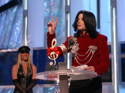 Michael Jackson - Michael Joseph Jackson (born August 29, 1958) is an American musician, entertainer and pop icon, whose successful music career and controversial personal life have been a part of pop culture for the last quarter-century.  Jackson began his musical career at the age of seven as the lead singer of The Jackson 5 and released his first solo recording, Got to Be There in 1971, while remaining a member of the group.[2] He began a full-fledged solo career in 1979 and formally parted with his siblings in 1984.[3] In his solo career, Jackson recorded and co-produced the best-selling album of all time, Thriller, which was named as the world's best-selling album at the 2006 World Music Awards. It has worldwide sales exceeding 104 million.[4] Michael Jackson has received thirteen Grammy awards[5] and charted thirteen number-one singles in the United States.  Throughout his four-decade career, Michael Jackson has been awarded numerous honors including the World Music Award's Best-Selling Pop Male Artist of the Millennium, American Music Award's Artist of the Century Award[6] and the Bambi Award's Pop Artist of the Millennium Award.[7] He is a double-inductee of the Rock and Roll Hall of Fame (once as a member of The Jackson 5 in 1997, and as a solo artist in 2001)[8] and an inductee of the Songwriters Hall of Fame.[9] Raymone Bain, Jackson's PR, claims that Jackson has sold over 750 million units worldwide.[10]  From 1988 to 2005, Jackson lived on his Neverland Ranch property, on which he built an amusement park and private zoo that was frequently attended by disadvantaged and terminally ill children. Rumours of sleepover parties received disparaging media coverage after it was revealed that children frequently slept in his bed or bedroom. These first came to light when he was accused of child sexual abuse in 1993. Michael Jackson's relationship with children was brought into the spotlight again in 2003 during the TV documentary Living with Michael Jackson. This resulted in Jackson being tried, and later acquitted, of more child molestation allegations and several other charges in 2005. Contents [hide] 1 Biography  1.1 1966–1980: Early life and career 1.2 1982–1986: The Thriller era 1.3 1987–1990: Bad and controversies 1.4 1991–1994: Dangerous and further career 1.5 1995–2000: HIStory and Blood on the Dance Floor 1.6 2001–2003: Invincible, Berlin and Martin Bashir 1.7 2003–2006: Trial, acquittal and the aftermath 1.8 2006–present: Visionary, Tokyo and the World Music Awards 2 Discography  2.1 Studio albums 2.2 Number-one singles  2.2.1 US number-one singles 2.2.2 UK number-one singles 3 Filmography  3.1 Notable music videos 3.2 Films 3.3 Videos/DVDs 3.4 Television 3.5 Video games 4 Music samples 5 Further reading 6 References 7 See also  7.1 Michael Jackson articles 7.2 Other related articles 8 External links  Biography  1966–1980: Early life and career Main articles: The Jackson 5 and Off the Wall   The cover to Michael Jackson's 1971's Got to Be There.  Michael Jackson was born in Gary, Indiana. He is the second-youngest brother of seven and the eighth of ten children of Joseph and Katherine Jackson. In 1966, after taking co-lead singing duties with brother Jermaine, the group's name changed from The Jackson Brothers to The Jackson 5. The group played at local clubs and bars, building up a following and eventually signing a contract with Motown Records in 1968.[11] The group hit stardom, with their first four singles which charted at number-one on the Billboard Hot 100. As a solo artist, Jackson released Got to Be There and Ben in 1972. These were released as part of the Jackson 5 franchise and produced successful singles such as 'Got to Be There', 'Ben', and a remake of Bobby Day's 'Rockin' Robin'.  The group's sales declined after 1973, and the group chafed under Motown's strict refusal to allow the Jacksons creative control or input. In 1976, the group signed a new contract with CBS Records (first joining the Philadelphia International division and then Epic Records).[12] When this became apparent to Motown Records, they sued the group for breach of contract.  As a result of the legal proceedings, which were complicated further by the fact that Jermaine Jackson was married to the daughter of Motown president (Berry Gordy), the Jacksons lost the rights to use the 'Jackson 5' name and logo and also Jermaine, who wanted to stay at Motown.[13] They changed their name to 'The Jacksons', featuring youngest brother Randy in Jermaine's place, and continued their successful career, touring internationally and releasing six more albums between 1976 and 1984, with Jermaine eventually re-joining in 1983, making them a sextet.  In 1978, Jackson starred as the scarecrow in The Wiz with former-label mate Diana Ross playing Dorothy.[14] The songs for the musical were arranged by Quincy Jones, who established a partnership with Jackson during the film's production and agreed to produce his first solo album in four years. Off the Wall, released in 1979, was a worldwide hit, and became the first album in history to spawn four top-ten hits, including 'Don't Stop 'Til You Get Enough' and 'Rock with You'.[2]  In January 1980, Jackson won his first awards for his solo efforts at the American Music Awards. He won 'Favorite Soul/R&B Album' (for Off the Wall), 'Favorite Male Soul/R&B Artist' and Favorite Soul/R&B Single (for 'Don't Stop 'Til You Get Enough').[2] Later that month, he also won two Billboard Awards (for 'Top Black Artist' and 'Top Black Album').[2]  On February 27, 1980, Jackson won a Grammy Award for 'Best R&B Vocal Performance, Male' (for 'Don't Stop 'Til You Get Enough').[2]  1982–1986: The Thriller era Main articles: Thriller (album), We Are the World, and Captain EO   The original album cover to 1982's Thriller.  In November 1982, the storybook for E.T.: The Extra-terrestrial was released. It included Jackson reading the story as well as one original song ('Someone in the Dark'). The album later won a Grammy for 'Best Album for Children'.  In December 1982, Jackson released his second Epic album, Thriller, which became the best-selling album in music history. The album spawned seven hit singles, including 'Billie Jean' (which was the first music video by a black artist to receive regular airplay on MTV), 'Beat It' and the album's title track which was accompanied by a revolutionary music video. The thirteen-minute Thriller was critically acclaimed, and massive airplay lead to it being packaged with the featurette Making Michael Jackson's Thriller on VHS, where it became the best-selling music home video ever.[15] Thriller spent 37 weeks at number-one and remained on the Billboard album chart for 122 weeks. It was eventually certified 27x Platinum in the United States.[16]   Jackson with the Reagans in 1984.  In 1983, whilst performing 'Billie Jean' at the Motown 25: Yesterday, Today, Forever concert Jackson debuted what can be regarded as his signature move: the moonwalk.[15] In 1983, he started a sponsorship deal with Pepsi-Cola, and, as part of the deal, he agreed to star in a commercial. While filming a Pepsi commercial with his brothers in 1984, before a live audience, his hair caught on fire when a pyrotechnic effect went wrong. Jackson suffered serious burns on his scalp, which required skin grafts.[17]  In February 1984, Jackson is nominated for twelve Grammy awards and wins eight,[15] breaking the record for the most Grammy Awards won in a single year.[18] Seven were for the critically acclaimed Thriller and the other for the E.T.: The Extra-terrestrial storybook. In 1984, he also won eight American Music Awards and the 'Special Award of Merit' and three MTV Video Music Awards.  After reuniting with his brothers, he then helped to write the Victory album. He then performed and starred in the successful Victory Tour which started on July 6, 1984 and lasted for five months.[15]  In 1985, Jackson was invited to the White House and was personally thanked by then-President Ronald Reagan at a White House ceremony for donating the song 'Beat It' for use in drunk driving prevention television and radio public service announcements.[19]   Jackson continued his charity work in 1985 by co-writing, with Lionel Richie, the hit single 'We Are the World'. The charity single helped to raise money and awareness for the famine in East Africa and was one of the first instances where Jackson was seen as a humanitarian. The song also won a Grammy Award for 'Song of the Year'.[15]   Jackson in the video for 'Beat It'.  Controversy began when Jackson purchased shares in the ATV Music Publishing (a company which owned the rights to most of the Beatles' songs), making himself the majority shareholder. This move angered close friend and songwriter Paul McCartney, who had also made a bid for the company. Ironically, it was McCartney who advised Jackson on the merits of song ownership.[20] Their creative co-writing ended after this event. Following this controversial business deal, tabloid stories of Jackson sleeping in a hyperbaric oxygen chamber to stall the aging-process, and an allegation claiming Jackson attempted to purchase the bones of the Elephant Man inspired the pejorative nickname 'Wacko Jacko'. The name 'Wacko Jacko' would come to be detested by Jackson.[21]  In 1986, Jackson starred in the George Lucas-produced, Francis Ford Coppola-directed 3-D film Captain EO. The film lasted 17 minutes but had costs estimated at $17 million.[22] At the time, it was the most expensive film ever produced on a per-minute basis. In the USA, the Disney theme parks hosted Captain EO. Disneyland featured the film in tomorrow-land from September 18, 1986 until April 7, 1997. It was also featured in Walt Disney World in Epcot from September 12, 1986 until July 6, 1994. Two new songs featured in the film. These were 'Another Part of Me', which later appeared on Bad, and 'We