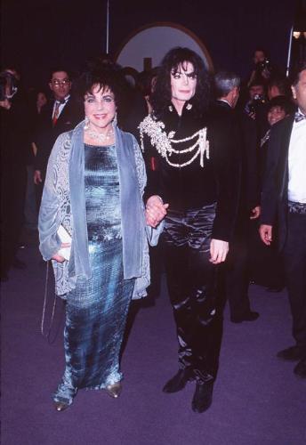 Michael Jackson - Michael Joseph Jackson (born August 29, 1958) is an American musician, entertainer and pop icon, whose successful music career and controversial personal life have been a part of pop culture for the last quarter-century.  Jackson began his musical career at the age of seven as the lead singer of The Jackson 5 and released his first solo recording, Got to Be There in 1971, while remaining a member of the group.[2] He began a full-fledged solo career in 1979 and formally parted with his siblings in 1984.[3] In his solo career, Jackson recorded and co-produced the best-selling album of all time, Thriller, which was named as the world's best-selling album at the 2006 World Music Awards. It has worldwide sales exceeding 104 million.[4] Michael Jackson has received thirteen Grammy awards[5] and charted thirteen number-one singles in the United States.  Throughout his four-decade career, Michael Jackson has been awarded numerous honors including the World Music Award's Best-Selling Pop Male Artist of the Millennium, American Music Award's Artist of the Century Award[6] and the Bambi Award's Pop Artist of the Millennium Award.[7] He is a double-inductee of the Rock and Roll Hall of Fame (once as a member of The Jackson 5 in 1997, and as a solo artist in 2001)[8] and an inductee of the Songwriters Hall of Fame.[9] Raymone Bain, Jackson's PR, claims that Jackson has sold over 750 million units worldwide.[10]  From 1988 to 2005, Jackson lived on his Neverland Ranch property, on which he built an amusement park and private zoo that was frequently attended by disadvantaged and terminally ill children. Rumours of sleepover parties received disparaging media coverage after it was revealed that children frequently slept in his bed or bedroom. These first came to light when he was accused of child sexual abuse in 1993. Michael Jackson's relationship with children was brought into the spotlight again in 2003 during the TV documentary Living with Michael Jackson. This resulted in Jackson being tried, and later acquitted, of more child molestation allegations and several other charges in 2005. Contents [hide] 1 Biography  1.1 1966–1980: Early life and career 1.2 1982–1986: The Thriller era 1.3 1987–1990: Bad and controversies 1.4 1991–1994: Dangerous and further career 1.5 1995–2000: HIStory and Blood on the Dance Floor 1.6 2001–2003: Invincible, Berlin and Martin Bashir 1.7 2003–2006: Trial, acquittal and the aftermath 1.8 2006–present: Visionary, Tokyo and the World Music Awards 2 Discography  2.1 Studio albums 2.2 Number-one singles  2.2.1 US number-one singles 2.2.2 UK number-one singles 3 Filmography  3.1 Notable music videos 3.2 Films 3.3 Videos/DVDs 3.4 Television 3.5 Video games 4 Music samples 5 Further reading 6 References 7 See also  7.1 Michael Jackson articles 7.2 Other related articles 8 External links  Biography  1966–1980: Early life and career Main articles: The Jackson 5 and Off the Wall   The cover to Michael Jackson's 1971's Got to Be There.  Michael Jackson was born in Gary, Indiana. He is the second-youngest brother of seven and the eighth of ten children of Joseph and Katherine Jackson. In 1966, after taking co-lead singing duties with brother Jermaine, the group's name changed from The Jackson Brothers to The Jackson 5. The group played at local clubs and bars, building up a following and eventually signing a contract with Motown Records in 1968.[11] The group hit stardom, with their first four singles which charted at number-one on the Billboard Hot 100. As a solo artist, Jackson released Got to Be There and Ben in 1972. These were released as part of the Jackson 5 franchise and produced successful singles such as 'Got to Be There', 'Ben', and a remake of Bobby Day's 'Rockin' Robin'.  The group's sales declined after 1973, and the group chafed under Motown's strict refusal to allow the Jacksons creative control or input. In 1976, the group signed a new contract with CBS Records (first joining the Philadelphia International division and then Epic Records).[12] When this became apparent to Motown Records, they sued the group for breach of contract.  As a result of the legal proceedings, which were complicated further by the fact that Jermaine Jackson was married to the daughter of Motown president (Berry Gordy), the Jacksons lost the rights to use the 'Jackson 5' name and logo and also Jermaine, who wanted to stay at Motown.[13] They changed their name to 'The Jacksons', featuring youngest brother Randy in Jermaine's place, and continued their successful career, touring internationally and releasing six more albums between 1976 and 1984, with Jermaine eventually re-joining in 1983, making them a sextet.  In 1978, Jackson starred as the scarecrow in The Wiz with former-label mate Diana Ross playing Dorothy.[14] The songs for the musical were arranged by Quincy Jones, who established a partnership with Jackson during the film's production and agreed to produce his first solo album in four years. Off the Wall, released in 1979, was a worldwide hit, and became the first album in history to spawn four top-ten hits, including 'Don't Stop 'Til You Get Enough' and 'Rock with You'.[2]  In January 1980, Jackson won his first awards for his solo efforts at the American Music Awards. He won 'Favorite Soul/R&B Album' (for Off the Wall), 'Favorite Male Soul/R&B Artist' and Favorite Soul/R&B Single (for 'Don't Stop 'Til You Get Enough').[2] Later that month, he also won two Billboard Awards (for 'Top Black Artist' and 'Top Black Album').[2]  On February 27, 1980, Jackson won a Grammy Award for 'Best R&B Vocal Performance, Male' (for 'Don't Stop 'Til You Get Enough').[2]  1982–1986: The Thriller era Main articles: Thriller (album), We Are the World, and Captain EO   The original album cover to 1982's Thriller.  In November 1982, the storybook for E.T.: The Extra-terrestrial was released. It included Jackson reading the story as well as one original song ('Someone in the Dark'). The album later won a Grammy for 'Best Album for Children'.  In December 1982, Jackson released his second Epic album, Thriller, which became the best-selling album in music history. The album spawned seven hit singles, including 'Billie Jean' (which was the first music video by a black artist to receive regular airplay on MTV), 'Beat It' and the album's title track which was accompanied by a revolutionary music video. The thirteen-minute Thriller was critically acclaimed, and massive airplay lead to it being packaged with the featurette Making Michael Jackson's Thriller on VHS, where it became the best-selling music home video ever.[15] Thriller spent 37 weeks at number-one and remained on the Billboard album chart for 122 weeks. It was eventually certified 27x Platinum in the United States.[16]   Jackson with the Reagans in 1984.  In 1983, whilst performing 'Billie Jean' at the Motown 25: Yesterday, Today, Forever concert Jackson debuted what can be regarded as his signature move: the moonwalk.[15] In 1983, he started a sponsorship deal with Pepsi-Cola, and, as part of the deal, he agreed to star in a commercial. While filming a Pepsi commercial with his brothers in 1984, before a live audience, his hair caught on fire when a pyrotechnic effect went wrong. Jackson suffered serious burns on his scalp, which required skin grafts.[17]  In February 1984, Jackson is nominated for twelve Grammy awards and wins eight,[15] breaking the record for the most Grammy Awards won in a single year.[18] Seven were for the critically acclaimed Thriller and the other for the E.T.: The Extra-terrestrial storybook. In 1984, he also won eight American Music Awards and the 'Special Award of Merit' and three MTV Video Music Awards.  After reuniting with his brothers, he then helped to write the Victory album. He then performed and starred in the successful Victory Tour which started on July 6, 1984 and lasted for five months.[15]  In 1985, Jackson was invited to the White House and was personally thanked by then-President Ronald Reagan at a White House ceremony for donating the song 'Beat It' for use in drunk driving prevention television and radio public service announcements.[19]   Jackson continued his charity work in 1985 by co-writing, with Lionel Richie, the hit single 'We Are the World'. The charity single helped to raise money and awareness for the famine in East Africa and was one of the first instances where Jackson was seen as a humanitarian. The song also won a Grammy Award for 'Song of the Year'.[15]   Jackson in the video for 'Beat It'.  Controversy began when Jackson purchased shares in the ATV Music Publishing (a company which owned the rights to most of the Beatles' songs), making himself the majority shareholder. This move angered close friend and songwriter Paul McCartney, who had also made a bid for the company. Ironically, it was McCartney who advised Jackson on the merits of song ownership.[20] Their creative co-writing ended after this event. Following this controversial business deal, tabloid stories of Jackson sleeping in a hyperbaric oxygen chamber to stall the aging-process, and an allegation claiming Jackson attempted to purchase the bones of the Elephant Man inspired the pejorative nickname 'Wacko Jacko'. The name 'Wacko Jacko' would come to be detested by Jackson.[21]  In 1986, Jackson starred in the George Lucas-produced, Francis Ford Coppola-directed 3-D film Captain EO. The film lasted 17 minutes but had costs estimated at $17 million.[22] At the time, it was the most expensive film ever produced on a per-minute basis. In the USA, the Disney theme parks hosted Captain EO. Disneyland featured the film in tomorrow-land from September 18, 1986 until April 7, 1997. It was also featured in Walt Disney World in Epcot from September 12, 1986 until July 6, 1994. Two new songs featured in the film. These were 'Another Part of Me', which later appeared on Bad, and 'We