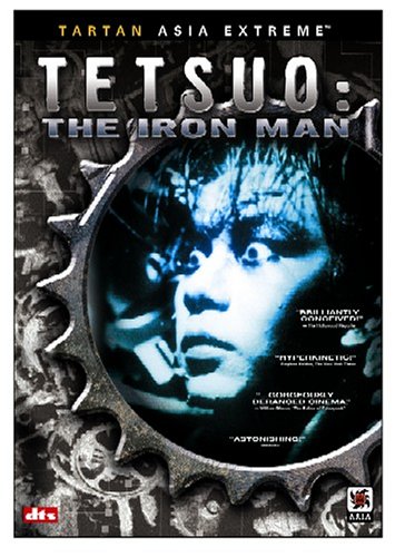tetsuo - Tetsuo: The Iron Man is a 1988 Japanese film by cult-film director Shinya Tsukamoto. This, his third film, is an extremely graphic but also strikingly-filmed fantasy shot in the same low-budget, underground-production style as his first two films. Tetsuo established Tsukamoto internationally and created his worldwide cult. It was followed by Tetsuo II: Body Hammer. The film opens with a man (called only'the man', or sometimes the'Metals Fetishist') tearing open a massive gash in his leg and shoving in a piece of scrap metal. Upon seeing maggots festering in the wound, he screams, runs out into the street, and is hit by a car. The driver of the car (cult actor Taguchi Tomorowo) tries to cover up the mess by dumping the body into a ravine, but the dead man comes back to haunt him -- by forcing his body to gradually metamorphose into a walking pile of scrap metal. In one of the film's most controversial sequences, the man discovers his pnis has mutated into a gargantuan power drill, and his girlfriend willingly copulates to death upon it. The film ends with a duel between the man and the Fetishist with the pair transformed into a giant mutated monster. One of the main themes of the movie is the main character's latent homosexuality. Some critics have seen this film as being a literal use of a metaphor, showing mankind's dehumanization and'becoming the machine'. The scene involving the businessman killing his girlfriend with his own pnis-turned-powerdrill is indicative of the dehumanization. The setting, which shows modern Japan as an industrial wasteland, suggests a post-apocalyptic nightmare. Some critics have suggested that Shinya Tsukamoto was making a statement on the dehumanization of industrialized Japan and the Japanese corporate culture. The film can also be seen as a comment on impotence as a metaphor for the feeling of alienation and helplessness in the face of byzantine corporate culture and modern urban life. The main character 'salary man' and his wife react with sexual arousal after they run over the metal fetishist, and the salary man is very different after the appearance of his'power tool pnis' from his former corporate-puppet-self. It is suggested that this state of virility is different from before the hit and run accident. The iron/machine-mutation comes to represent personal empowerment, with both good and bad sides to it. This is even further underscored by the shape of the mutated creature which appears at the end of the film, which is more than a bit similar to an erect pnis. It has been often discussed that Tetsuo is a metaphor for the spread of the AIDS virus. The film is Unrated but contains substantial strange violent and sexual imagery. The film is also discussed in Clive Barkers'A-Z Book of Horror'. The DVD has been released in America and elsewhere from Tartan Asia Extreme.