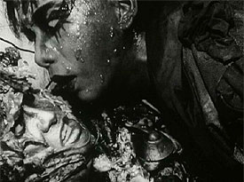 tetsuo - Tetsuo: The Iron Man is a 1988 Japanese film by cult-film director Shinya Tsukamoto. This, his third film, is an extremely graphic but also strikingly-filmed fantasy shot in the same low-budget, underground-production style as his first two films. Tetsuo established Tsukamoto internationally and created his worldwide cult. It was followed by Tetsuo II: Body Hammer. The film opens with a man (called only'the man', or sometimes the'Metals Fetishist') tearing open a massive gash in his leg and shoving in a piece of scrap metal. Upon seeing maggots festering in the wound, he screams, runs out into the street, and is hit by a car. The driver of the car (cult actor Taguchi Tomorowo) tries to cover up the mess by dumping the body into a ravine, but the dead man comes back to haunt him -- by forcing his body to gradually metamorphose into a walking pile of scrap metal. In one of the film's most controversial sequences, the man discovers his pnis has mutated into a gargantuan power drill, and his girlfriend willingly copulates to death upon it. The film ends with a duel between the man and the Fetishist with the pair transformed into a giant mutated monster. One of the main themes of the movie is the main character's latent homosexuality. Some critics have seen this film as being a literal use of a metaphor, showing mankind's dehumanization and'becoming the machine'. The scene involving the businessman killing his girlfriend with his own pnis-turned-powerdrill is indicative of the dehumanization. The setting, which shows modern Japan as an industrial wasteland, suggests a post-apocalyptic nightmare. Some critics have suggested that Shinya Tsukamoto was making a statement on the dehumanization of industrialized Japan and the Japanese corporate culture. The film can also be seen as a comment on impotence as a metaphor for the feeling of alienation and helplessness in the face of byzantine corporate culture and modern urban life. The main character 'salary man' and his wife react with sexual arousal after they run over the metal fetishist, and the salary man is very different after the appearance of his'power tool pnis' from his former corporate-puppet-self. It is suggested that this state of virility is different from before the hit and run accident. The iron/machine-mutation comes to represent personal empowerment, with both good and bad sides to it. This is even further underscored by the shape of the mutated creature which appears at the end of the film, which is more than a bit similar to an erect pnis. It has been often discussed that Tetsuo is a metaphor for the spread of the AIDS virus. The film is Unrated but contains substantial strange violent and sexual imagery. The film is also discussed in Clive Barkers'A-Z Book of Horror'. The DVD has been released in America and elsewhere from Tartan Asia Extreme.