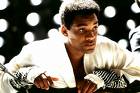 Ali - In 1964, a brash new pro boxer, fresh from his olympic gold medal victory, explodes on to the scene, Cassius Clay. Bold and outspoken, he cuts an entirely new image for African American's in sport with his proud public self confidence with his unapologetic belief that he is the greatest boxer of all time. To his credit, he sets out to prove that with his highly agile and forceful style soon making him a formidable boxer who soon claims the heavyweight championship. His personal life is no less noteworthy with his allegiance to the Nation of Islam, his friendship with the controversial Malcolm X and his abandonment of his slave name in favour of Muhammad Ali stirring up controversy. Yet, at the top of his game, both Ali's personal and professional lives face the ultimate test with the military draft rules are changed, making him eligible for military induction during the Vietnam War. Despite the fact that he could easily agree to a sweetheart deal that would have meant an easy tour of duty for himself, Ali refuses to submit on principle to cooperate in an unjust war for a racist nation that treated his people so poorly. The cost of that stand is high as he finds himself unable to legally box in his own country while his case is contested in court. What follows is a battle for a man who would sacrifice so much for what he believes in and a comeback that would cement his legend as one of the great sports figures of all time.
