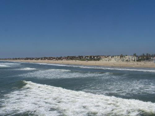 H.B. - This photo was taken from Huntington Beach Pier, CA.  I grew up at this beach, and learned how to surf. We were there for a visit last summer and this picture brings back so many good memories.