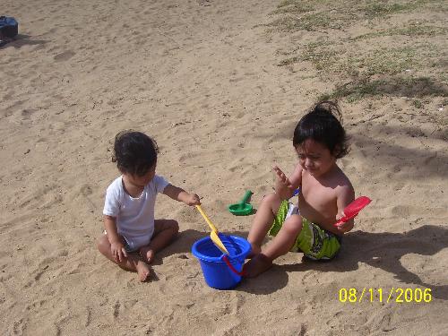 My babies - This is a picture of my two babies. Ramiro is the oldest. He is three years old. Dayanira is my baby girl at 16 months old. They are here playing in the sand at Hanauma Bay in Hawaii. We go here at least once a month so the kids can have fun in the sand and so Ramiro can see fish with out looking through glass. The fish swim right around your feet! If you go early enough you can see turtles.