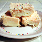 creamy orange fudge - ingredients 2 pounds white chocolate, melted  2 (8 ounce) packages cream cheese  6 cups confectioners' sugar  1 tablespoon orange extract    directions beat cream cheese into melted chocolate until well blended. beat in confectioner's sugar until mixture is smooth. Stir in orange extract. spread in an 8x8 inch dish and let set before cutting into squares. store in refrigerator.