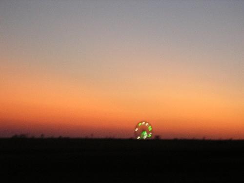 dusk - Fair lights with sun setting in background