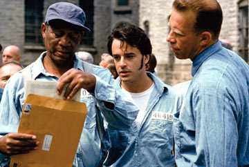 The Shawshank Redemption  - Andy Dufresne, a mild mannered New England banker, is convicted of murdering his wife and her lover. Despised at first by the other inmates because of his introverted manner, Andy slowly forges an unlikely friendship with Red, a seasoned lifer and his gang. Soon, Andy also becomes popular with the prison guards, including the vicious Captain Hadley who offers him protection against the jail's rougher convicts in exchange for financial counseling. The prison warden also takes advantage of Andy's banking knowledge by exchanging privileges for creative bookkeeping. Over a twenty year period, Andy is able to maintain his sanity and dignity in prison not by physical force but by mental force. His smarts and confidence keep him going and he is able to teach the other prisoners that hope is the ultimate means of survival.